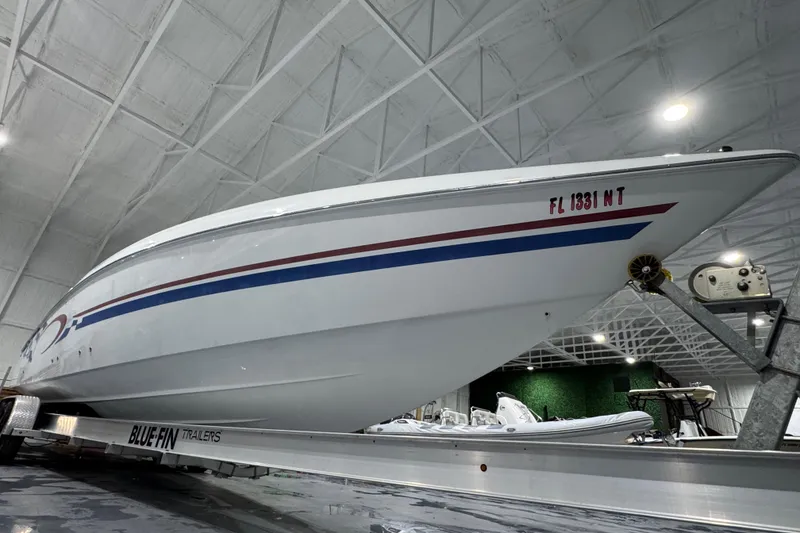 Slide: The Image of 2002 Baja .38 Special boat on Blue Fin trailer in indoor storage facility. - 4