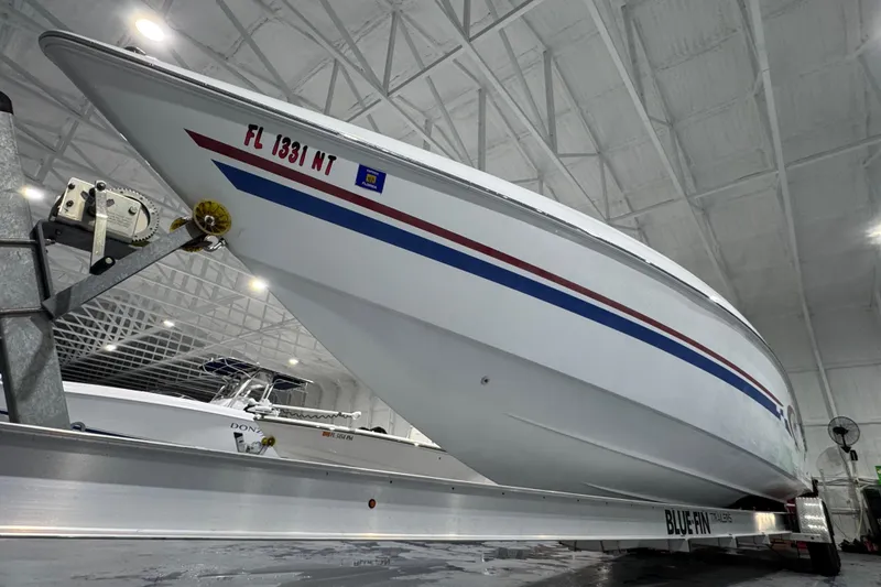 Slide: The Image of 2002 Baja .38 Special boat on trailer in indoor storage facility. - 5