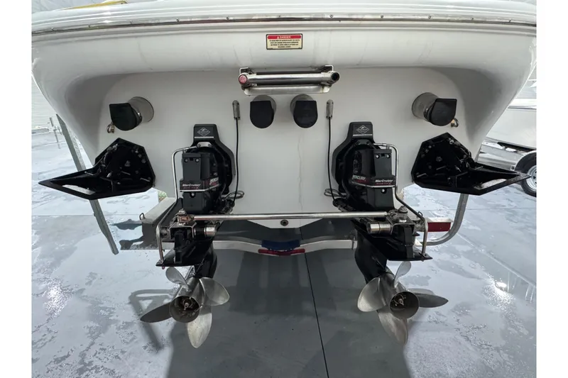 Slide: The Image of Rear view of a 2002 Baja .38 Special boat with dual propellers and MerCruiser engines. - 7