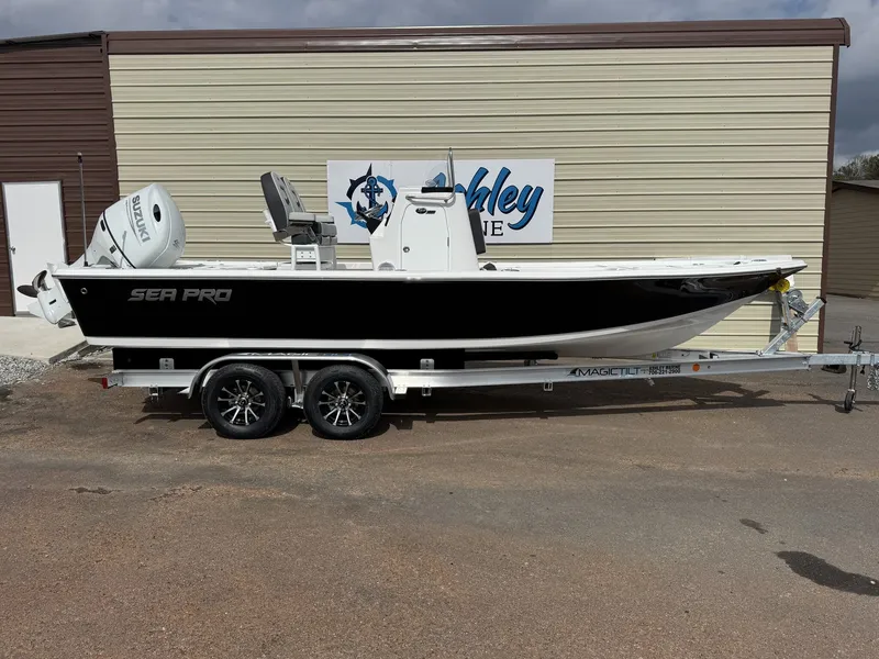 The Image of 2026 Sea Pro 230 Bay boat on trailer in front of building. - 1