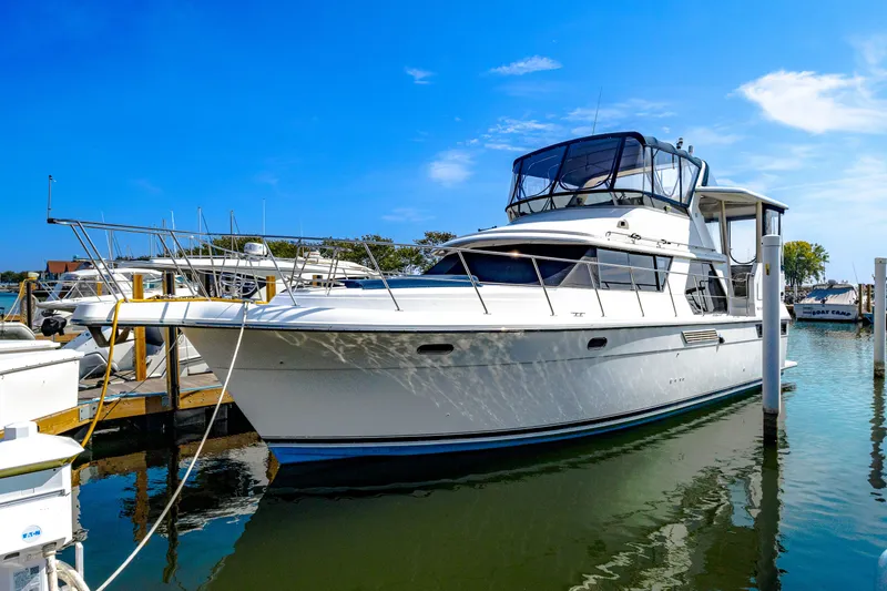 The Image of 1994 Carver 440 Aft Cabin Motor Yacht docked in harbor. - 0