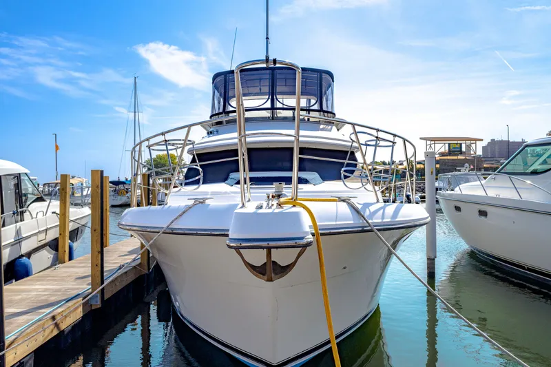 Slide: The Image of 1994 Carver 440 Aft Cabin Motor Yacht docked at marina. - 1