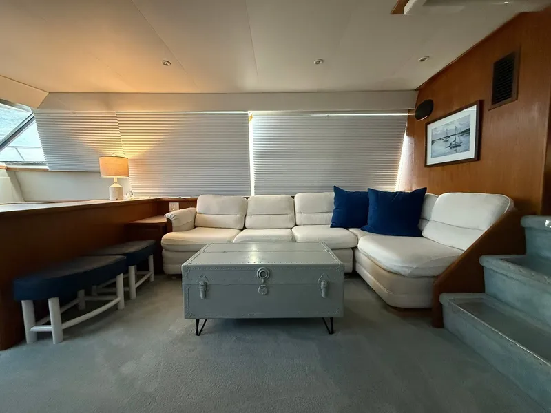 Slide: The Image of Interior of 1994 Carver 440 Aft Cabin Yacht with sofa and table. - 23
