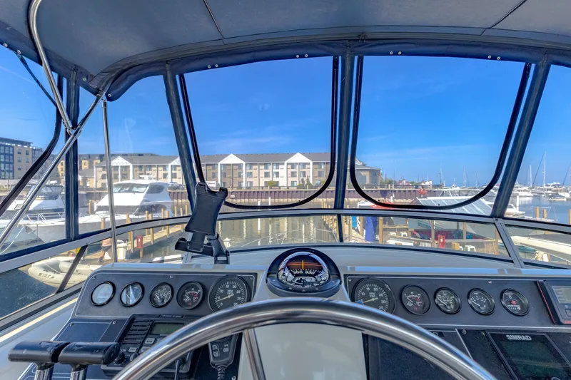 Slide: The Image of Interior view of Carver 440 yacht, overlooking the marina. - 6