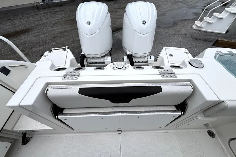 Slide: The Image of 2024 Sailfish 272 CC boat with dual outboard engines and sleek design. - 3