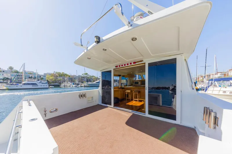 Slide: The Image of 1996 Navigator 5300 Classic yacht with spacious deck and marina view. - 10