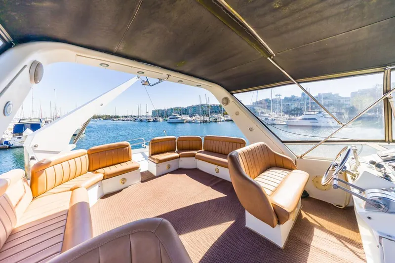 Slide: The Image of Spacious interior of 1996 Navigator 5300 Classic yacht with leather seating and marina view. - 26