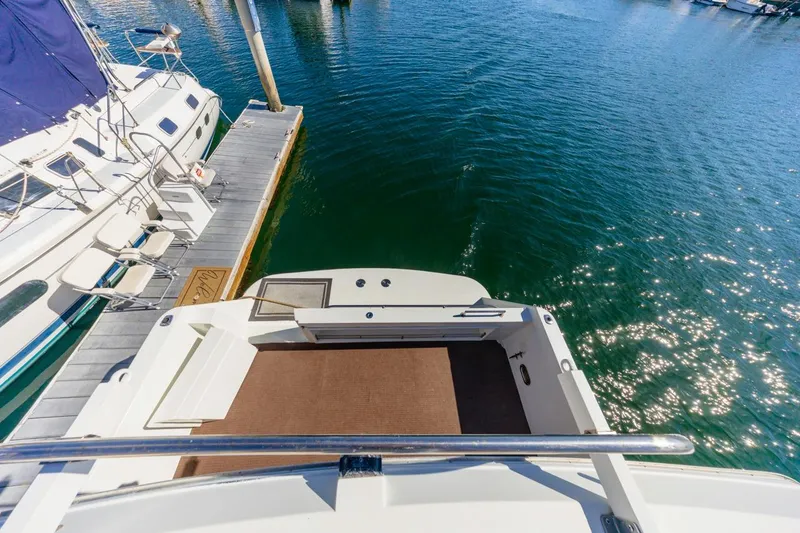 Slide: The Image of 1996 Navigator 5300 Classic yacht docked at marina, viewed from above. - 29