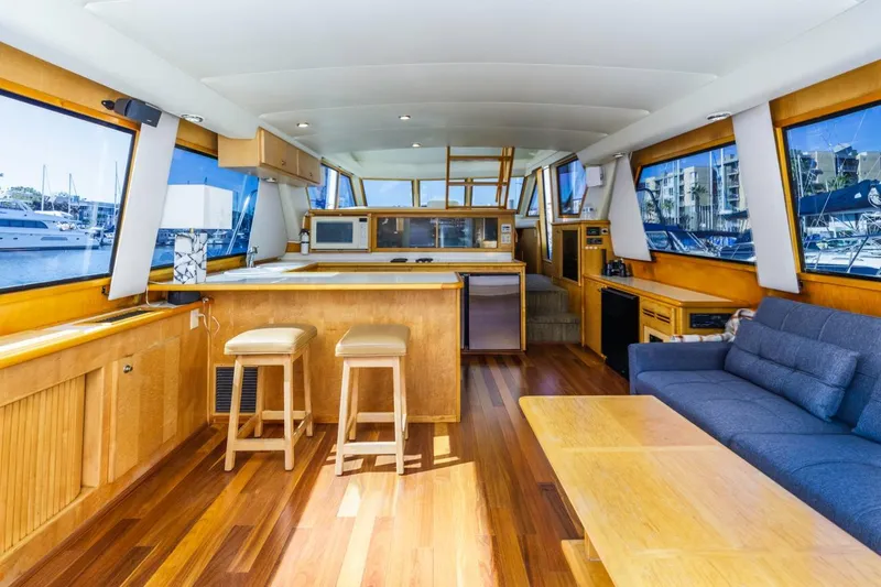 Slide: The Image of Interior of 1996 Navigator 5300 Classic yacht with wooden flooring and modern furnishings. - 32