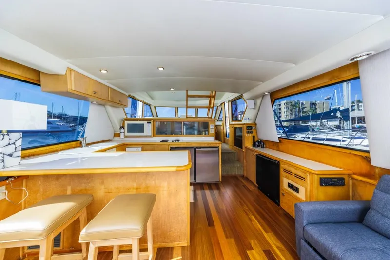 Slide: The Image of Interior of 1996 Navigator 5300 Classic yacht with wooden flooring and modern amenities. - 33