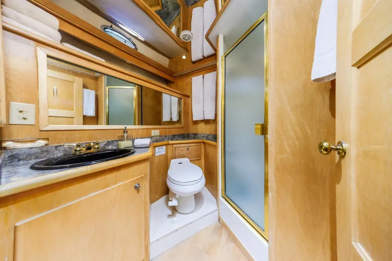 Slide: The Image of Luxurious bathroom in 1996 Navigator 5300 Classic yacht with wood accents and modern fixtures. - 41