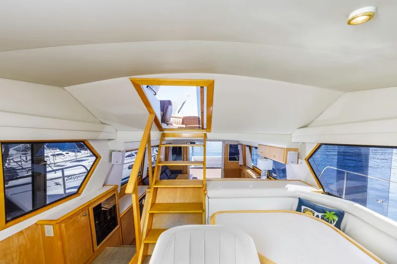 Slide: The Image of Interior of 1996 Navigator 5300 Classic yacht with wooden accents and spacious seating area. - 48