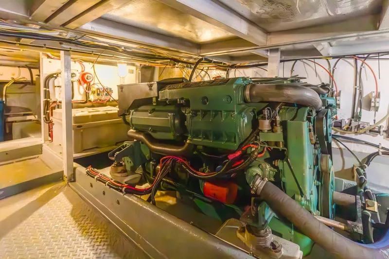 Slide: The Image of Engine room of 1996 Navigator 5300 Classic yacht, showcasing detailed machinery and wiring. - 59