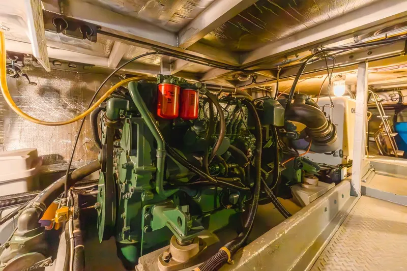 Slide: The Image of Engine room of 1996 Navigator 5300 Classic yacht, showcasing detailed mechanical components. - 60