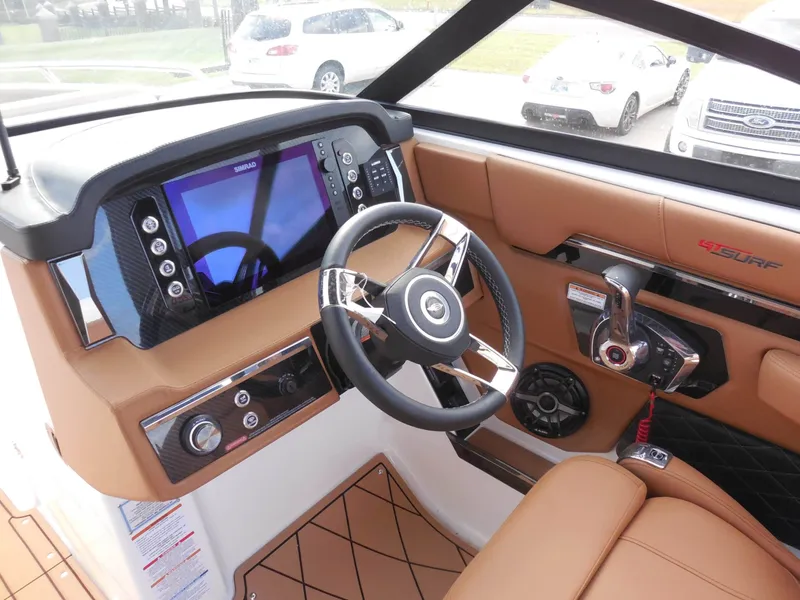 Slide: The Image of The image shows the cockpit of a 2026 Chaparral GTS 6 with a modern steering wheel and large display. - 20