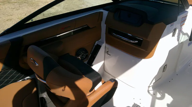 Slide: The Image of Interior of Chaparral GTS 6 boat, 2026 model, featuring brown leather seats. - 20