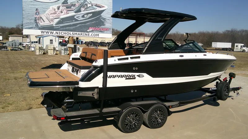 Slide: The Image of 2026 Chaparral GTS 6 boat on trailer, parked outdoors. - 6