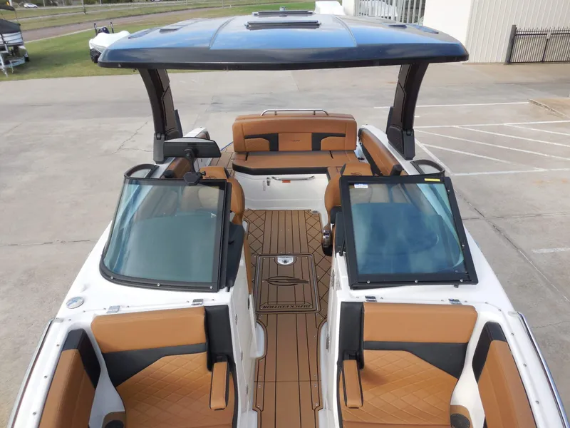 Slide: The Image of 2026 Chaparral GTS 6 with brown seating and open deck. - 26