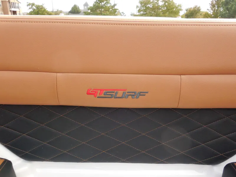 Slide: The Image of Close-up of a brown and black seat with "GTSURF" logo. - 23