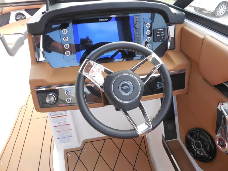 Slide: The Image of The image shows the cockpit of a 2026 Chaparral GTS 6 with a modern steering wheel and large display. - 21