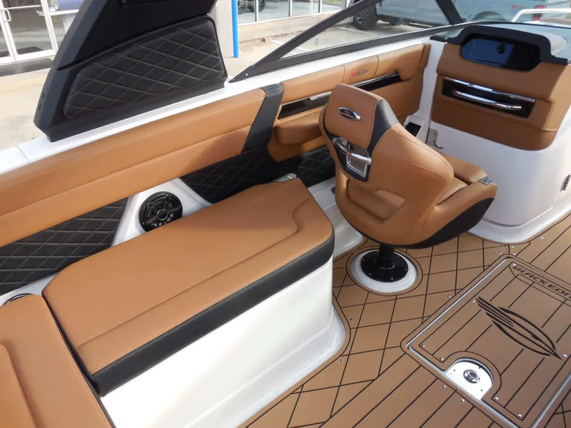 Slide: The Image of Interior of a 2026 Chaparral GTS 6 with brown leather seating and a modern dashboard. - 19