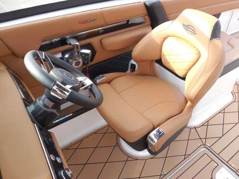 Slide: The Image of Interior of a 2026 Chaparral GTS 6 with luxurious brown leather seating and a modern steering wheel. - 28