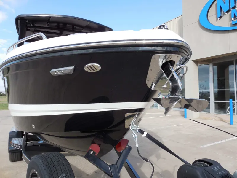 Slide: The Image of The image shows a black 2026 Chaparral GTS 6 boat on a trailer. - 10