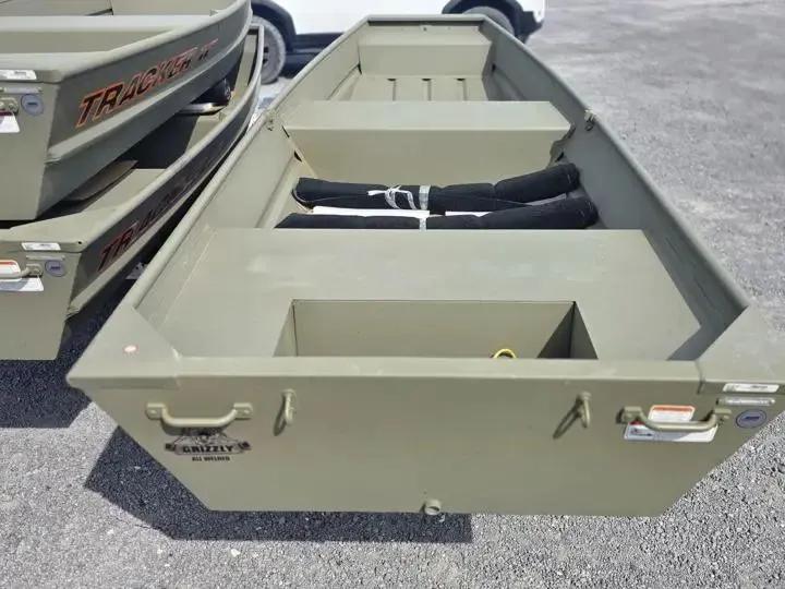 Slide: The Image of 2026 Tracker Grizzly 14 Jon boat on parking lot. - 3