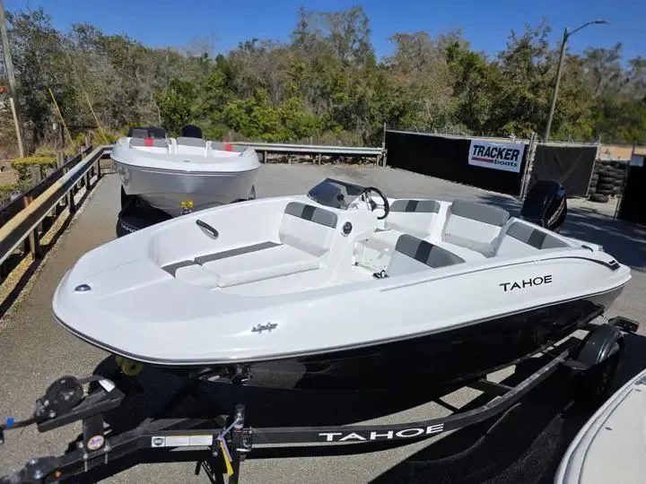 The Image of 2026 Tahoe T16 boat on a trailer outdoors. - 1