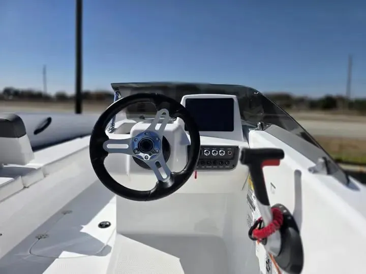 Slide: The Image of Interior view of 2026 Tahoe T16 boat cockpit with steering wheel and controls. - 10