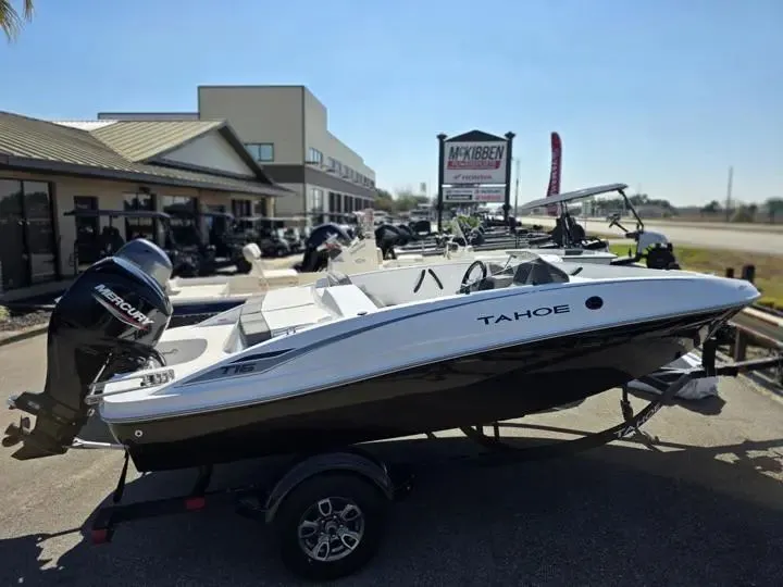 Slide: The Image of 2026 Tahoe T16 boat on trailer outside a dealership. - 5