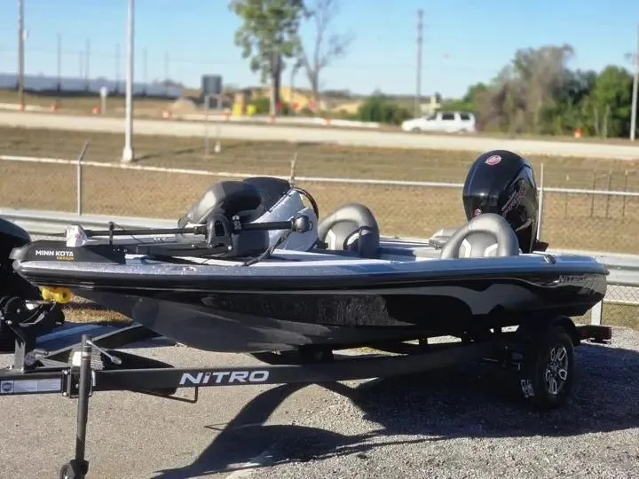 The Image of 2026 Nitro Z17 boat on trailer, parked outdoors. - 1
