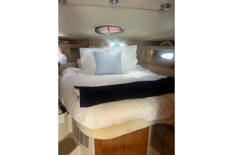 Slide: The Image of Luxurious cabin interior of 2004 Regal Commodore 3860 yacht with cozy bedding. - 12
