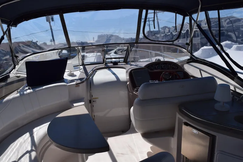 Slide: The Image of Interior view of 2004 Regal Commodore 3860 yacht with seating and helm. - 18