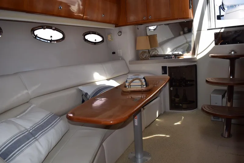Slide: The Image of Luxurious interior of 2004 Regal Commodore 3860 yacht with elegant seating and wooden accents. - 20