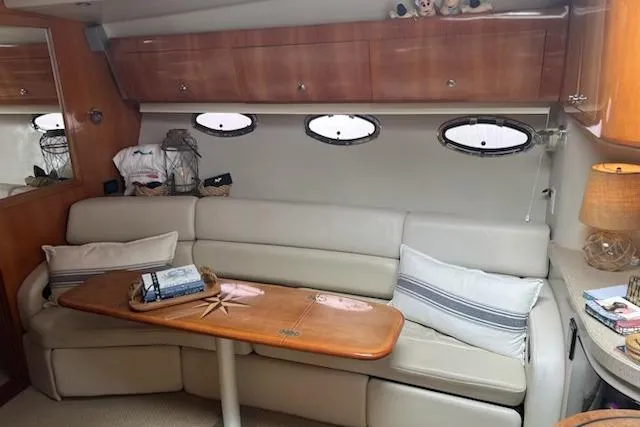 Slide: The Image of Luxurious interior of 2004 Regal Commodore 3860 yacht with plush seating and elegant decor. - 21