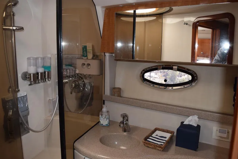 Slide: The Image of Bathroom interior of 2004 Regal Commodore 3860 yacht, featuring shower and sink area. - 31