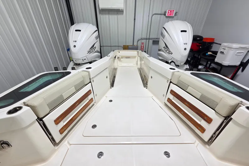 Slide: The Image of 2020 Solace 345 boat interior with Yamaha V8 engines in a garage setting. - 10