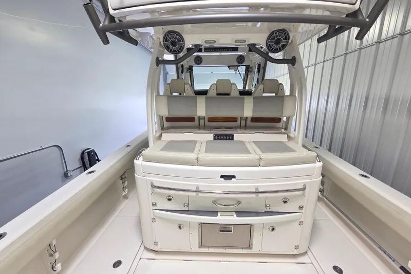 Slide: The Image of 2020 Solace 345 boat interior with seating and storage compartments in a sleek design. - 12