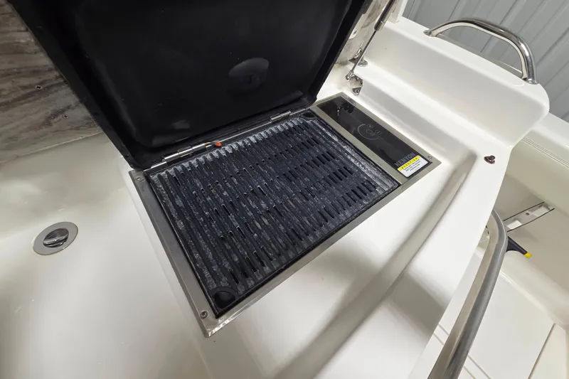 Slide: The Image of Built-in grill on 2020 Solace 345 boat, featuring sleek design and stainless steel finish. - 15