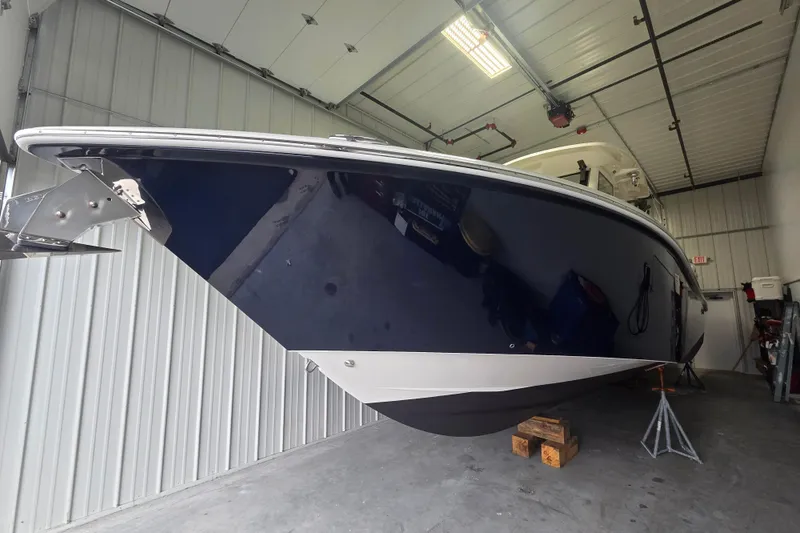 Slide: The Image of 2020 Solace 345 boat in storage, showcasing sleek design and modern features. - 2