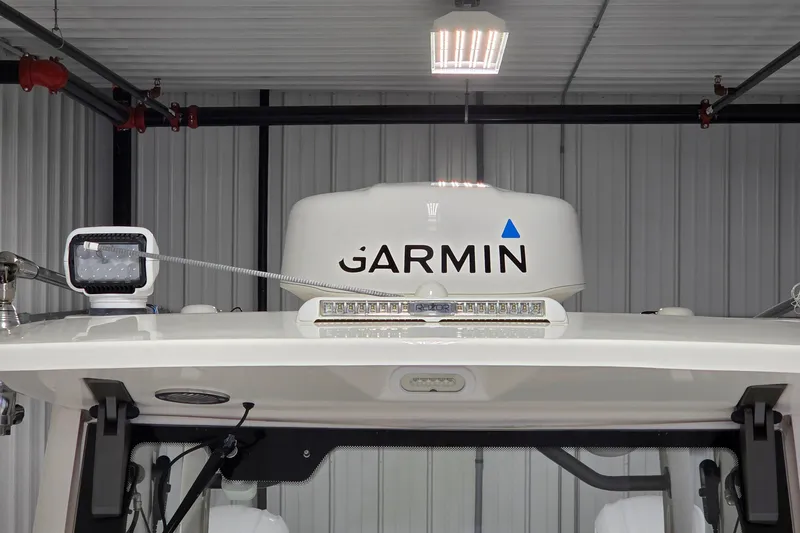 Slide: The Image of 2020 Solace 345 boat with Garmin radar and LED lights in a garage. - 20