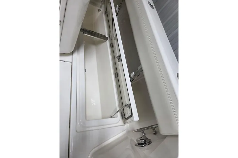 Slide: The Image of Open storage compartment on 2020 Solace 345 boat, showcasing sleek design and functionality. - 21