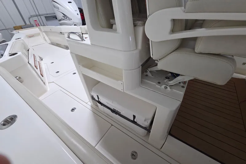 Slide: The Image of Interior of a 2020 Solace 345 boat, featuring seating and storage compartments. - 25