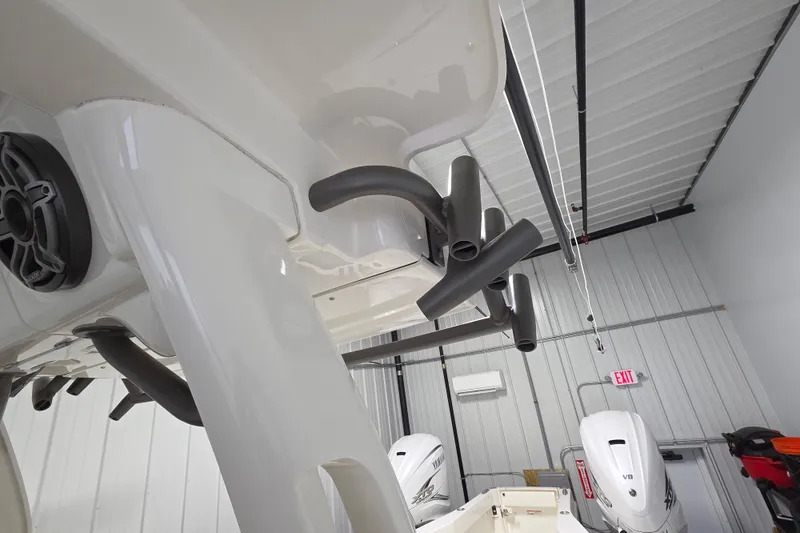 Slide: The Image of 2020 Solace 345 boat in garage, featuring multiple rod holders and Yamaha engines. - 27