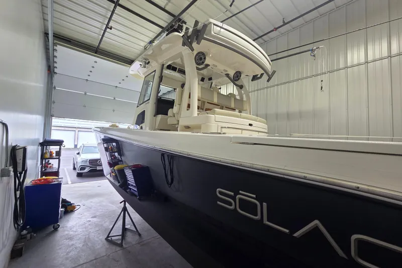 Slide: The Image of 2020 Solace 345 boat in storage, showcasing sleek design and modern features. - 3