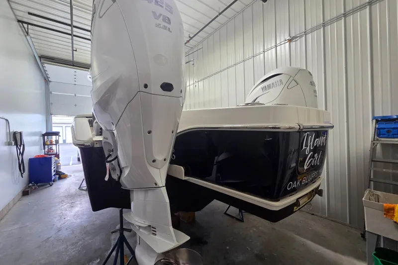 Slide: The Image of 2020 Solace 345 boat with Yamaha V8 engine in a storage facility. - 4