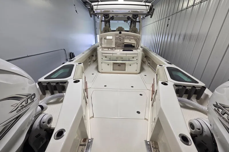 Slide: The Image of 2020 Solace 345 boat interior with dual XTO Offshore engines in a storage facility. - 9