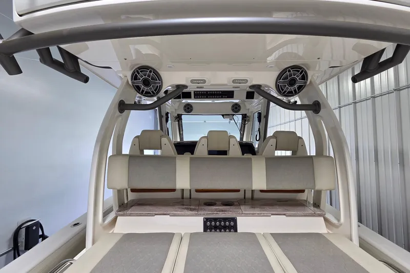 Slide: The Image of 2020 Solace 345 boat interior with seating, speakers, and control panel. - 16