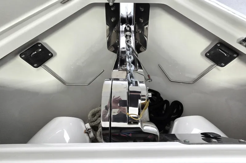 Slide: The Image of Anchor compartment of 2020 Solace 345 boat with polished metal fittings. - 22